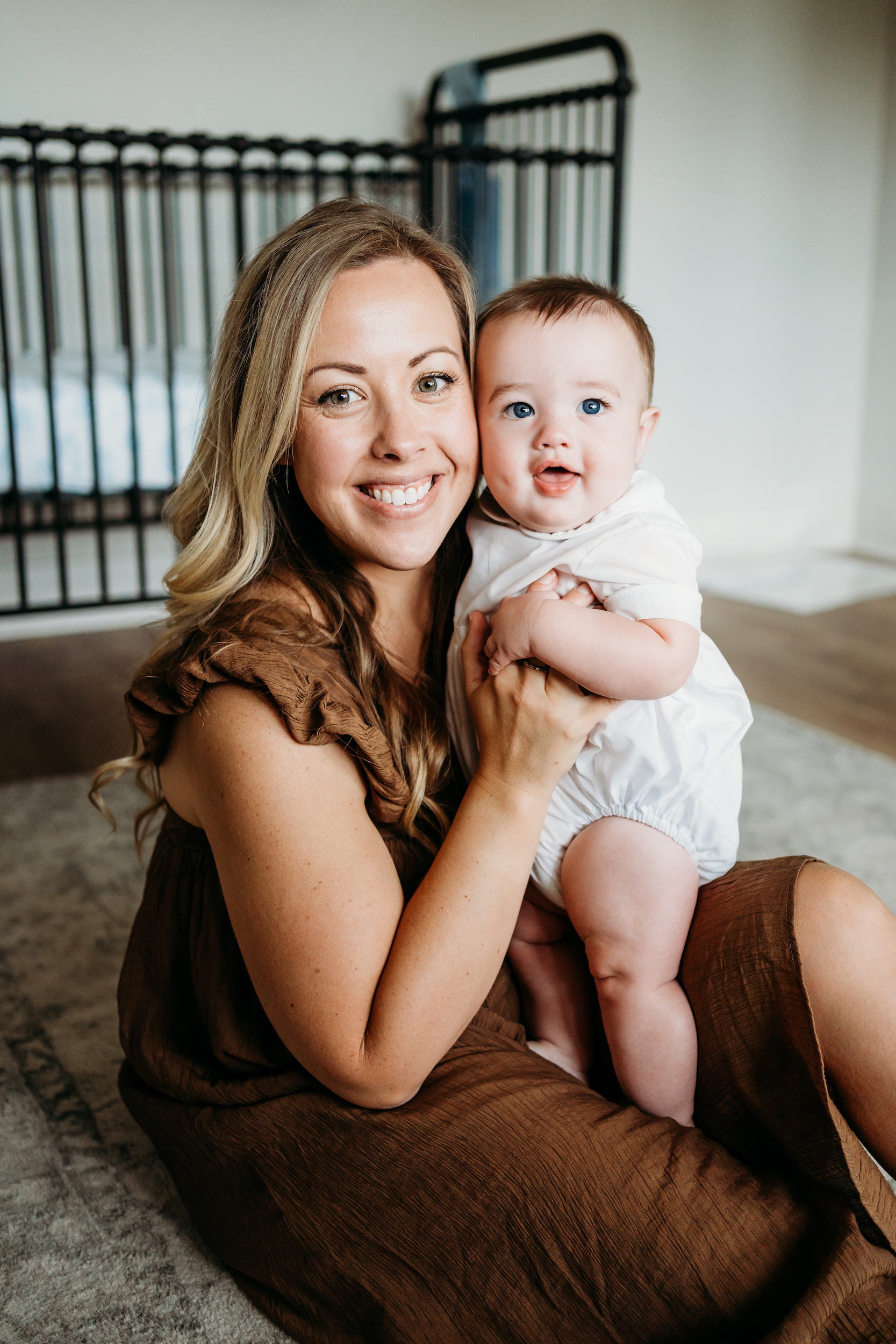 Mom and baby smililng after visiting Alabama Tongue-Tie Center