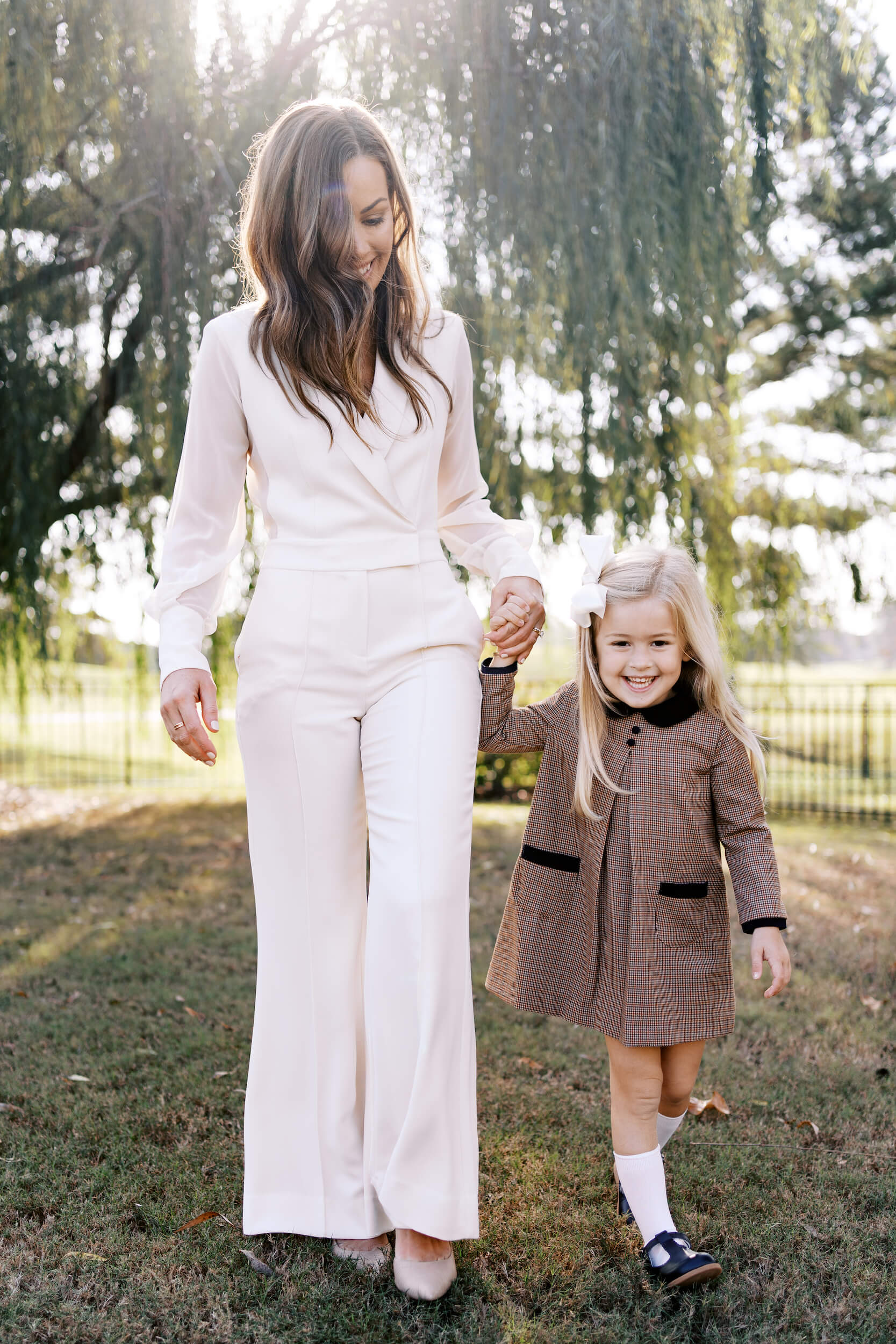 Mom and daughter playing in the sunshine.